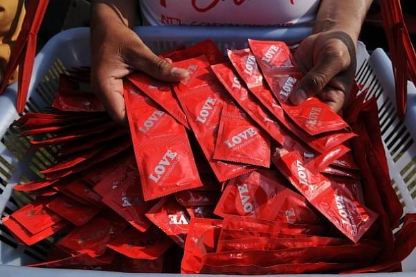  People gather to observe the International Condom Day at an event organised by Aids Healthcare Foundation (AHF) in New Delhi. (Burhaan Kinu/Hindustan Times via Getty Images)