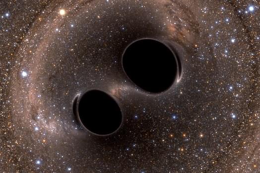 Gravitational waves being released. (Simulating eXtreme Spacetimes/ Wiki Commons)
