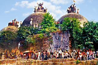 <i>Kar sewaks </i>on top of the disputed structure in Ayodhya.