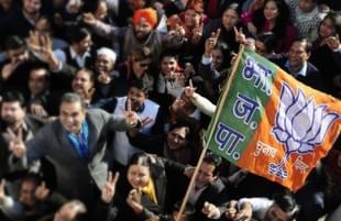 The BJP party workers celebrate the victory of the party in Gujarat and Himachal Pradesh at the party office in Chandigarh. (Keshav Singh/Hindustan Times)