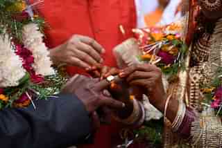 A marriage in India. (Burhaan Kinu/Hindustan Times via Getty Images)