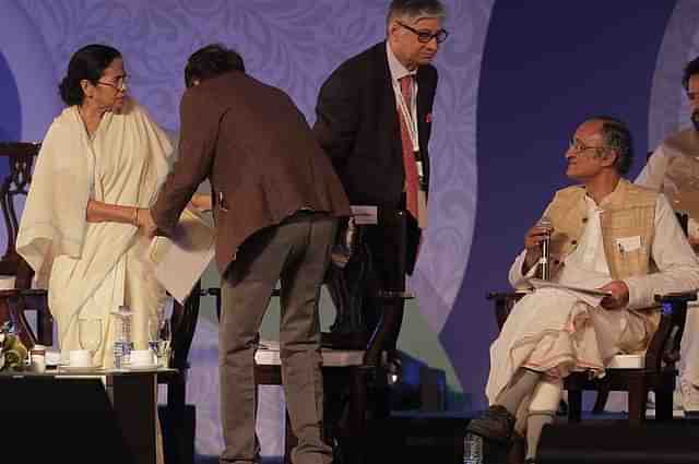 Bengal Chief Minister Mamata Banerjee and Finance Minister Amit Mitra at the Bengal Global Business Summit 2016 in Kolkata. (Indranil Bhoumik/Mint via Getty Images)