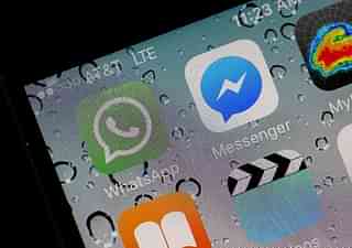 The WhatsApp application is displayed on an iPhone in 2016. (Justin Sullivan/Getty Images)