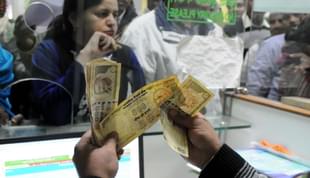 A banker counting old banknotes during demonetisation (Parveen Kumar/Hindustan Times via Getty Images)