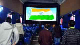 Audience standing for a national anthem in a theatre (Hindustan Times via Getty Images)