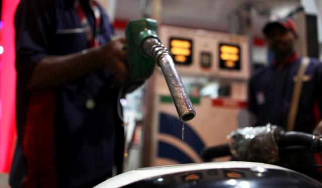 A car owner gets his fuel tank filled with petrol from a petrol pump at Prabhadevi. (Sattish Bate/Hindustan Times via Getty Images)