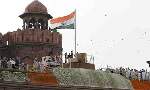 Prime Minister Narendra Modi salutes the national flag before addressing the nation on 68th Independence Day at the Red Fort on August 15, 2014 in New Delhi, India. (Mohd Zakir/Hindustan Times via Getty Images)