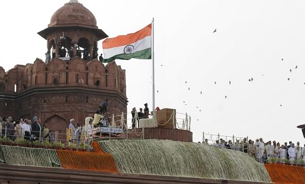 Prime Minister Narendra Modi salutes the national flag before addressing the nation on 68th Independence Day at the Red Fort on August 15, 2014 in New Delhi, India. (Mohd Zakir/Hindustan Times via Getty Images)