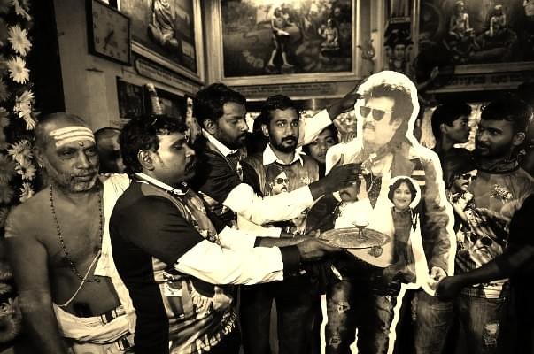 Rajinikanth fans doing <i>aarti</i> in front of his cut-out on the release of <i>Kabali</i> at Matunga Murugan Temple on in Mumbai, India. (Arijit Sen/Hindustan Times via Getty Images)
