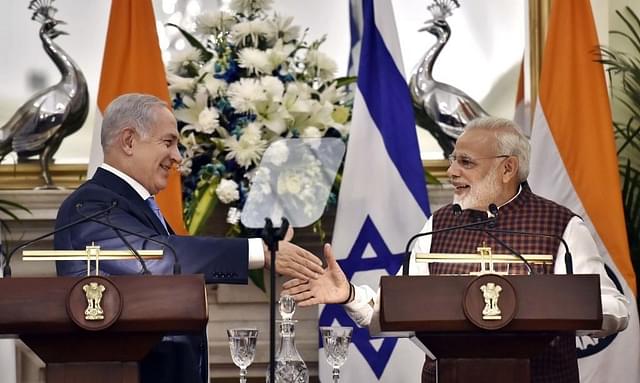 Prime Minister Narendra Modi and Israeli Prime Minister Benjamin Netanyahu shake hands as they issue a joint statement after delegation-level talks at Hyderabad House in New Delhi. (Ajay Aggarwal/Hindustan Times via Getty Images)&nbsp;