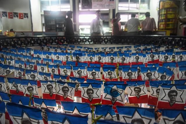 A cinema hall decorated with the flags bearing images of Rajinikanth in Mumbai. (Pratik Chorge/Hindustan Times via GettyImages)