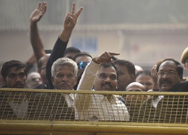 DMK leader and former union telecom minister A Raja with his supporters celebrating after the 2G case verdict. (Sonu Mehta/Hindustan Times via Getty Images)