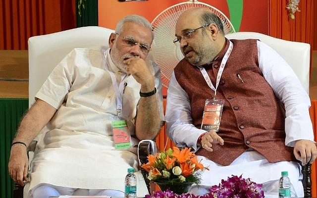 Prime Minister Narendra Modi with Union Home Minister Amit Shah. (Photo credit:  RAVEENDRAN/AFP/Getty Images))