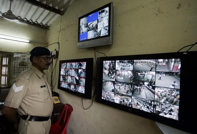 A Railway police officer monitors CCTV footage at Borivili station in Mumbai (Prasad Gori/Hindustan Times via Getty Images)