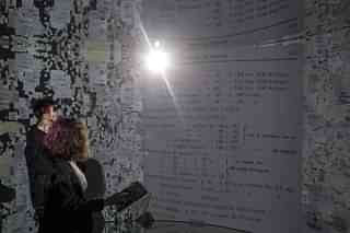 People view historical documents and photographs displayed in a high tech art installation at Salt Galata on May 6, 2017 in Istanbul, Turkey. The ‘Archive Dreaming’ installation by artist Refik Anadol uses artificial intelligence to visualize nearly 2 million historical Ottoman documents and photographs from the SALT Research Archive. (Chris McGrath/Getty Images)