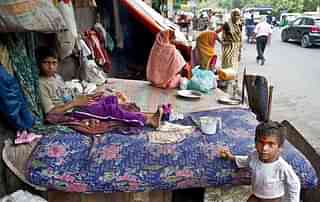 Poor families living on the streets. (PRAKASH SINGH/AFP/Getty Images)