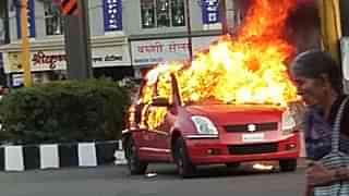 The car set on fire in Bhopal. (India Today via Twitter)