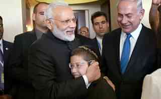 Narendra Modi, Moshe Holtzberg and Benjamin Netanyahu during Modi’s visit to Israel last year