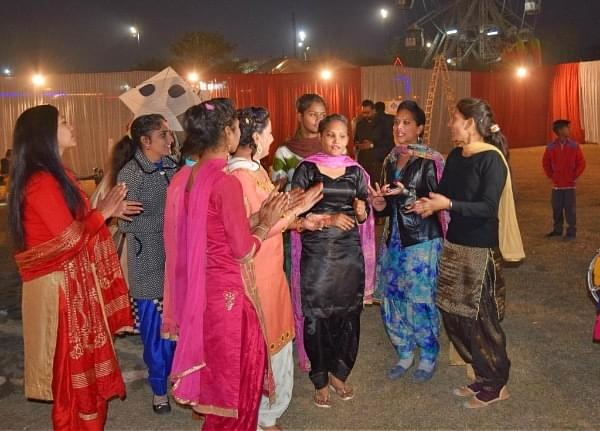 Women singing folk songs as part of Lohri celebrations