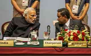 Prime Minister Narendra Modi speaks to Abdulla Yameen, President of the Maldives during  the 18th SAARC Summit in  Nepal. (Narendra Shrestha - Pool/Getty Images)
