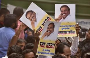 Supporters of A Raja celebrate after 2G case verdict in New Delhi. (Sonu Mehta/Hindustan Times via GettyImages)