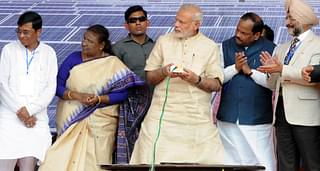 PM Modi during the inaugural function of a rooftop solar plant on Gandhi Jayanti. (Diwakar Prasad/Hindustan Times via Getty Images)