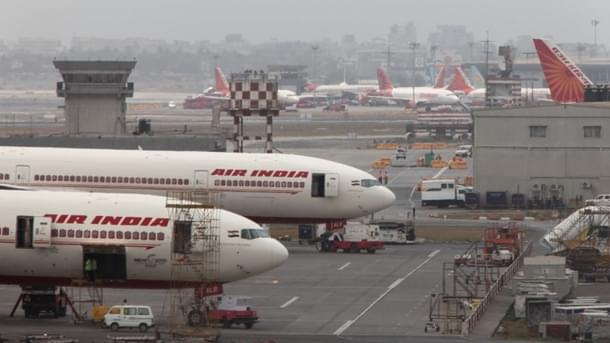 Air India aircraft are seen parked on the tarmac of the international airport in Mumbai. (Sattish Bate/Hindustan Times via Getty Images)