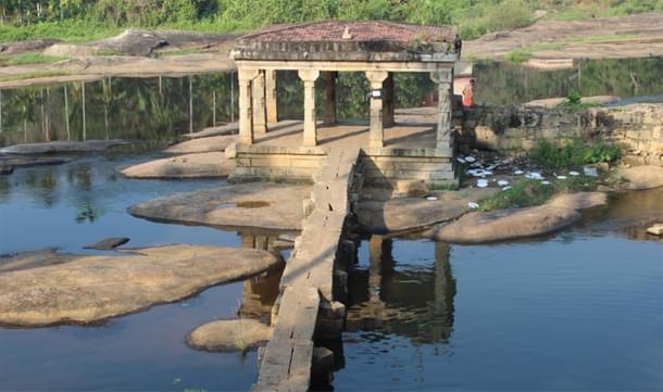 A stone <i>Mandapam</i> attached to the <i>Thirparapu Mahadeva</i> temple – one of the twelve temples. Note the scenic beauty being marred by the wastes dumped near the Mandapam.