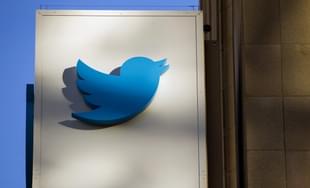 The Twitter Inc. logo is displayed on the facade of the company’s headquarters in San Francisco. (David Paul Morris/Bloomberg via Getty Images) 