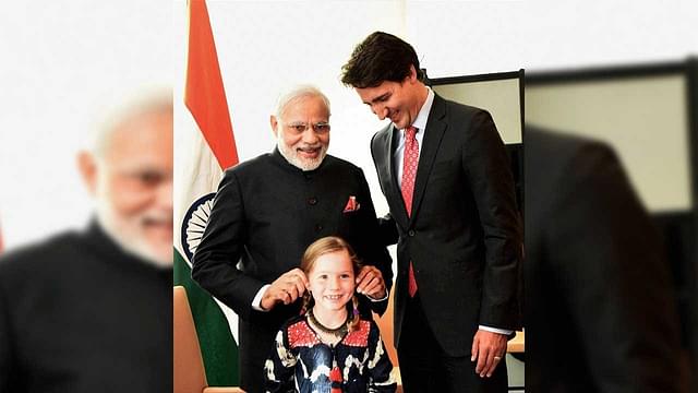Indian Prime Minister Narendra Modi meets Prime Minister Justin Trudeau and his daughter Ella-Grace.