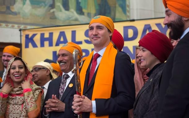 Prime Minister Justin Trudeau with members of the Sikh Caucus. (THE CANADIAN PRESS/ Adrian Wyld)