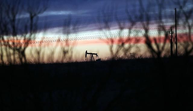An oil pumpjack works at dawn in the Permian Basin oil field  in the oil town of Andrews, Texas. (Spencer Platt/Getty Images)&nbsp;