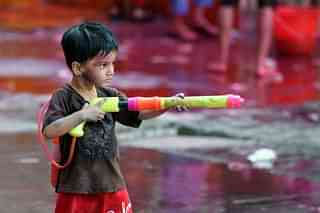 Children enjoy as they celebrate holi at Sion in Mumbai. (Kunal Patil/Hindustan Times via GettyImages)