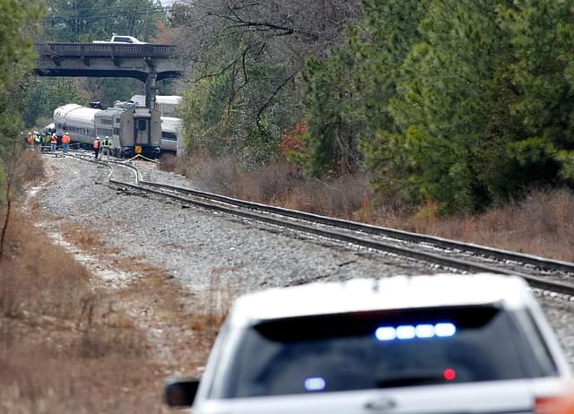 Investigators work at the scene of a crash under the Charleston Highway overpass where two trains collided in Cayce, South Carolina (Bob Leverone/Getty Images)