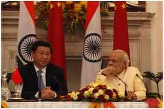 Chinese President Xi Jinping (L) and Prime Minister Narendra Modi (Arvind Yadav/Hindustan Times via Getty Images)