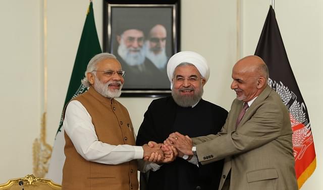 President Ghani, Prime Minister Modi and President Rouhani (C) shake hands in Tehran (Pool/ Iran Presidency/Anadolu Agency/Getty Images)
