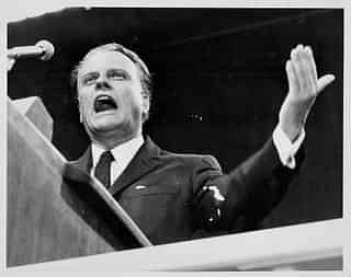 American evangelist Billy Graham, giving a speech at Earl’s Court, London, on 2 June 1960. (Ted West/Central Press/Getty Images)