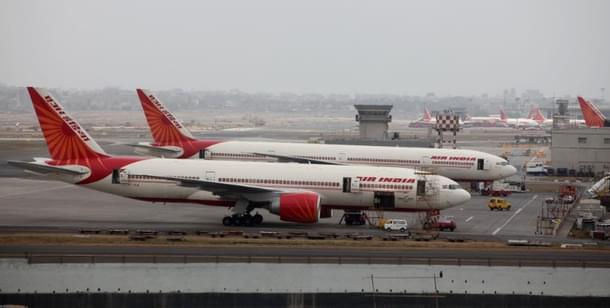 Air India aircraft are seen parked on the tarmac of the international airport in Mumbai. (Sattish Bate/Hindustan Times via Getty Images)