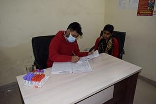 A patient giving her blood sample. (Ekta Chauhan)