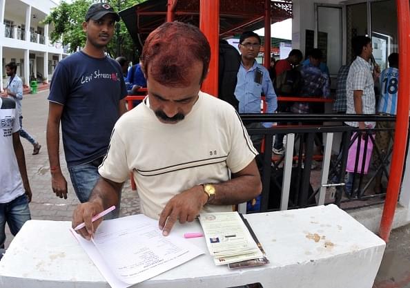 A devotee filling his registration form in a queue at Base Camp in Jammu in 2017