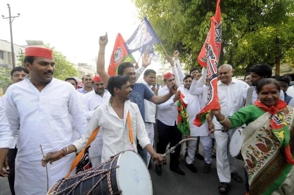 SP workers along with BSP members celebrate after winning the Lok Sabha election seats in Uttar Pradesh in Noida. (Sunil Ghosh/Hindustan Times via Getty Images)