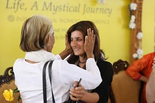 A poignant moment as Parveen, an  IS survivor, exchanges hugs with delegates from India at the  International Women’s Conference in Bengaluru.