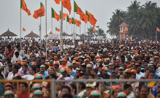 People gathered at Maple beach for BJP national President Amit Shah’s speech during Fishermen’s convention at Maple beach on February 20, 2018 in Udupi, India. (Arijit Sen/Hindustan Times via Getty Images)