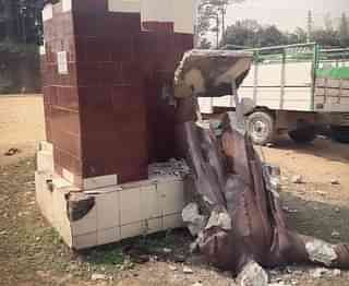 The broken Lenin statue at Sabroom Motor Stand