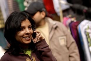 A woman talking on her mobile phone at Chandani Chowk market in New Delhi. (Pradeep Gaur/Mint via Getty images) 