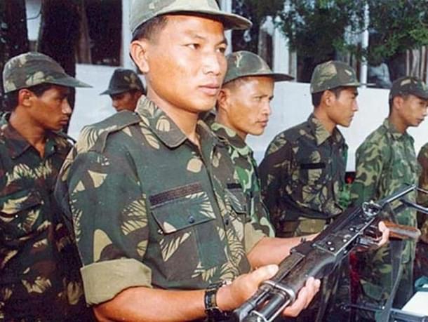The NSCN insurgents surrendering arms.