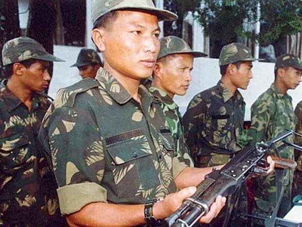 The NSCN insurgents surrendering arms. 