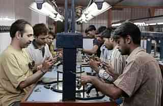 Workers busy polishing diamonds at a factory in Dahisar. (Satish Bate/Hindustan Times via Getty Images)