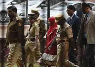 The 24-year-old Hadiya alias Akhila (in red dress) at the Supreme Court after hearing  in New Delhi. (Vipin Kumar/Hindustan Times via Getty Images)