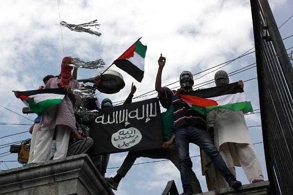  Kashmiri protesters hold up a flag of ISIS during a protest against Israeli military operations in Gaza, in Srinagar. (Waseem Andrabi/Hindustan Times via Getty Images)